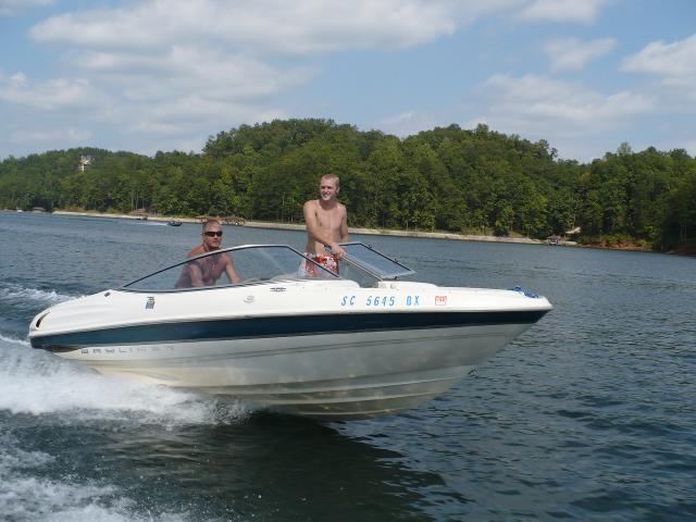 Two men using a boat