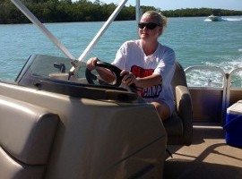 Woman driving a boat