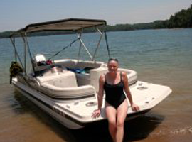 Beautiful woman sitting on the boat