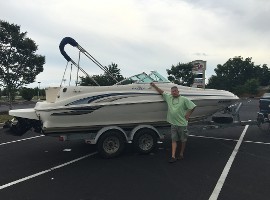 Man taking a picture on boat