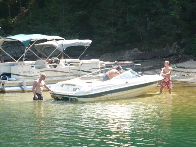 Group of man using a boat