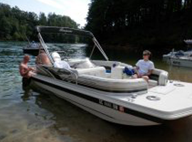 Man sitting in front of the boat