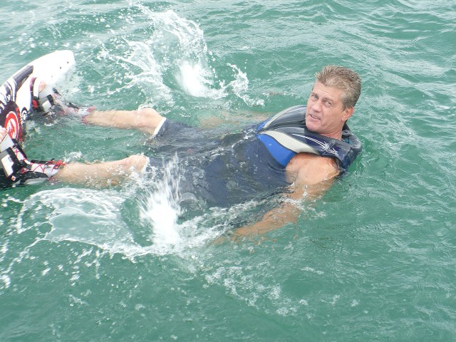 Man wearing a life vest while on swimming