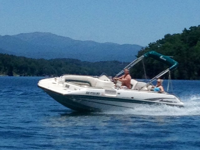 Happy couple while using a boat